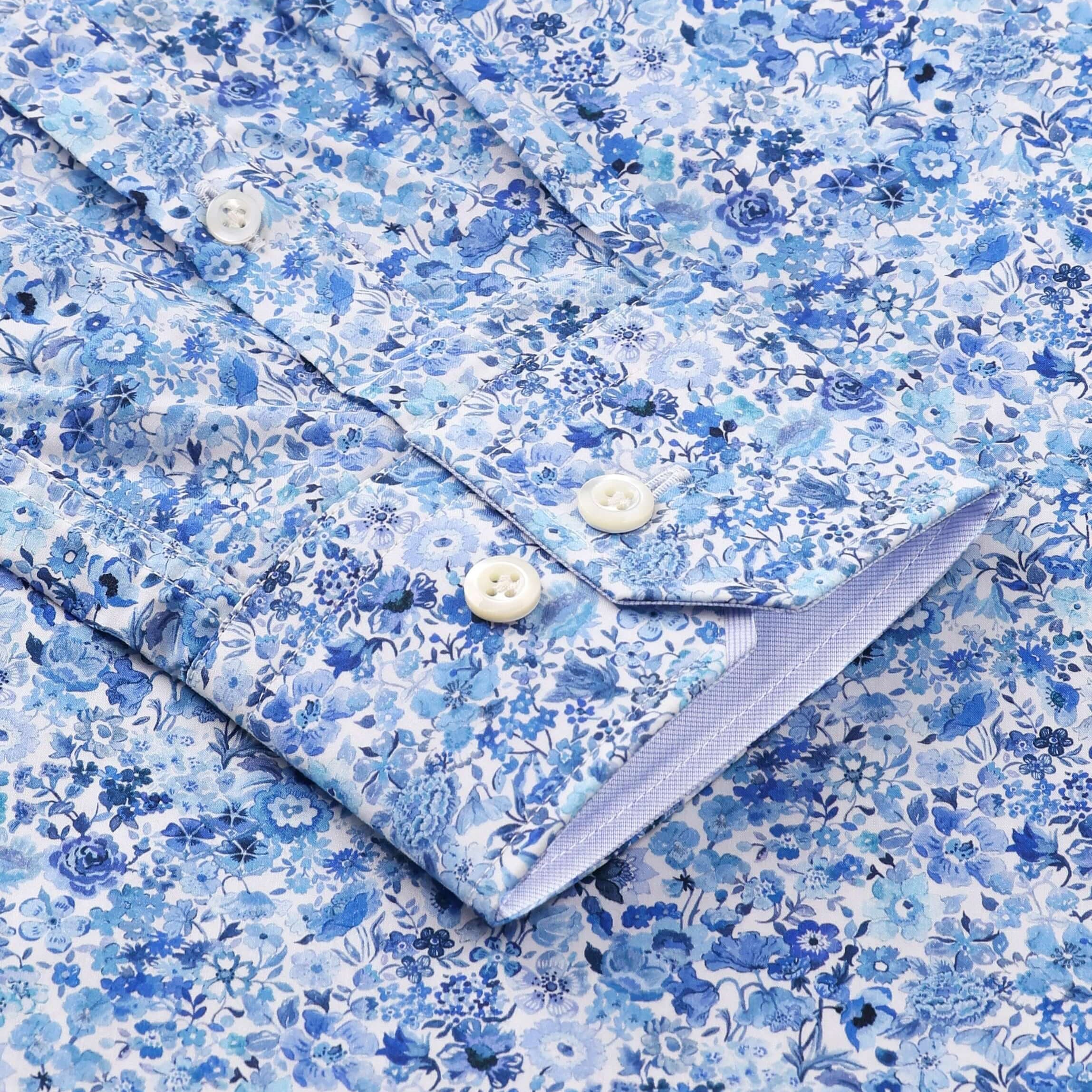 Close-up of Charles Luxury Men's Floral Dress Shirt – White/Blue | Treffort, featuring a blue floral pattern on cotton fabric.