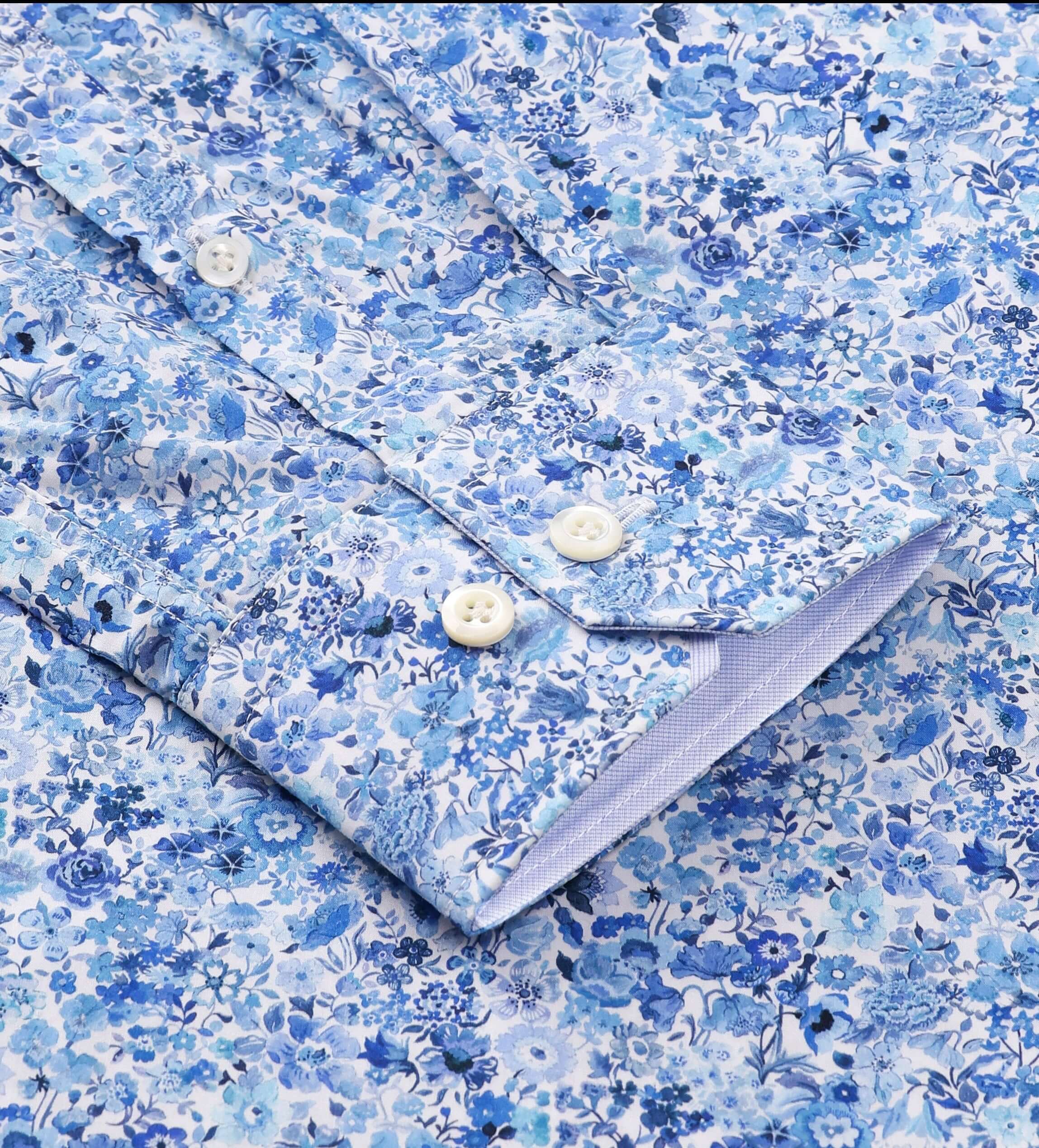 Close-up of Charles Luxury Men's Floral Dress Shirt – White/Blue | Treffort, featuring a blue floral pattern on cotton fabric.