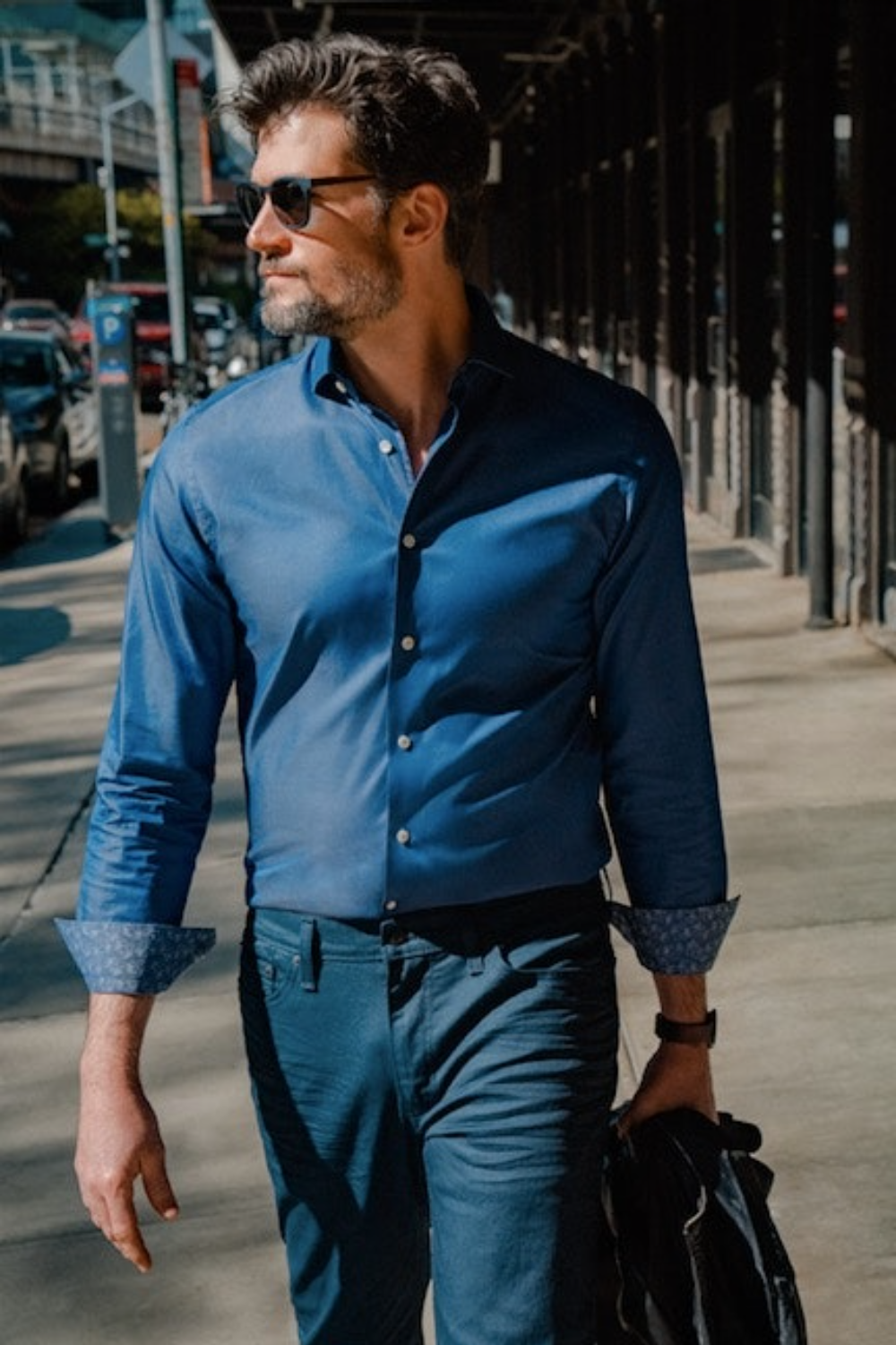 MODEL WEARING LUXURY BLUE CHAMBRAY MERCER SLIM FIT DRESS SHIRT WITH CONTRAST DETAIL
