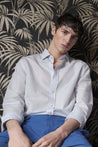 MODEL WEARING TREFFORT MEN'S HIGH END LUXURY BLUE TUDOR CONTEMPORARY REGULAR FIT LINEN DRESS SHIRT WITH BLUE PANTS