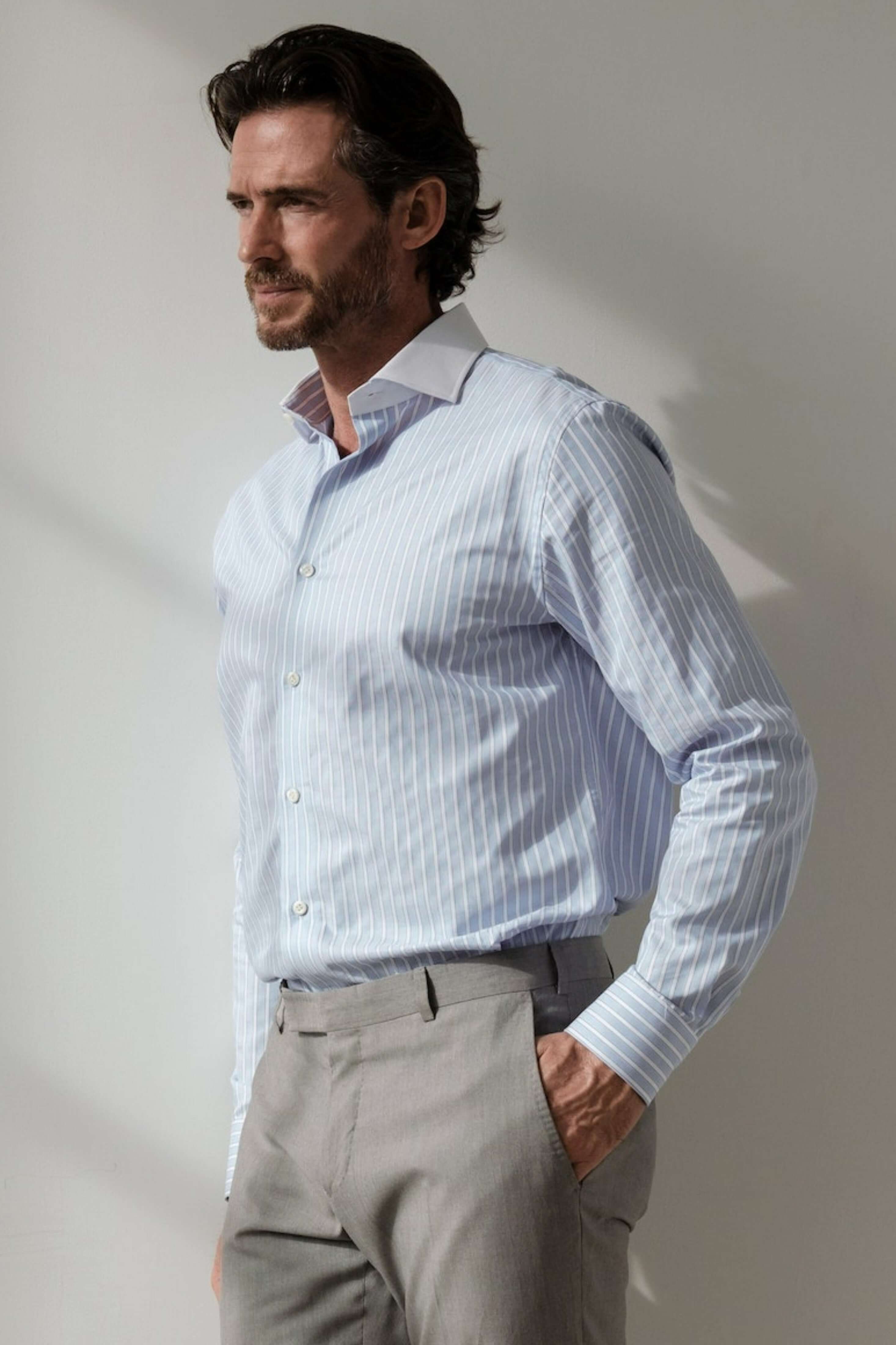 Hester Luxury Men's Striped Dress Shirt – Blue | Treffort modeled displaying timeless elegance and European craftsmanship